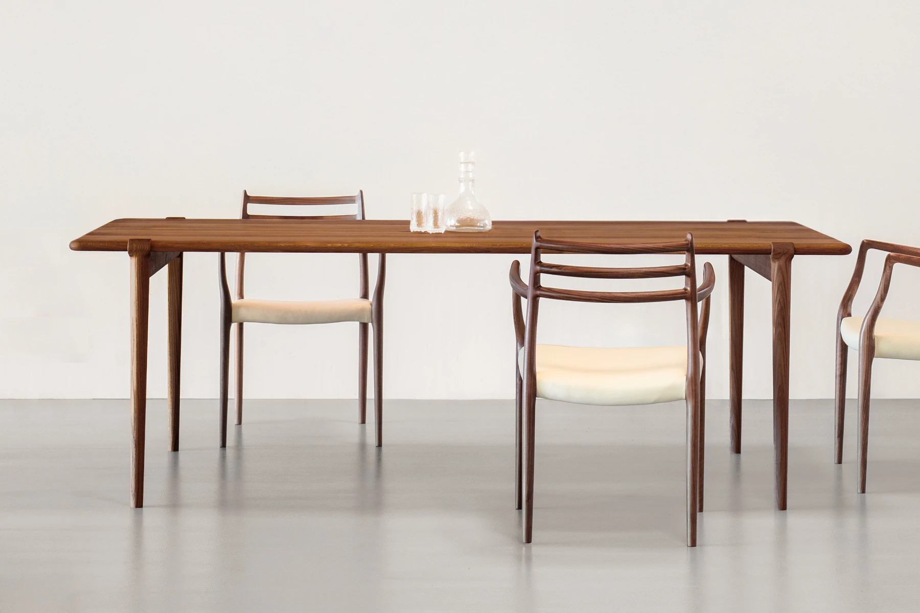 danish modern mid century vintage mobilier en teck palissandre Rio années 50 années 60 années 70 mobilier meuble ancien danois Danemark scandinave maison nordik paris meubles décoration design nordique éditeur marque J. L. Møller designers Kirsten Møller and Mikkel Bruun Sundtoft table de repas en noyer 2 Longueurs au choix 180cm ou 220cm table à manger table à diner